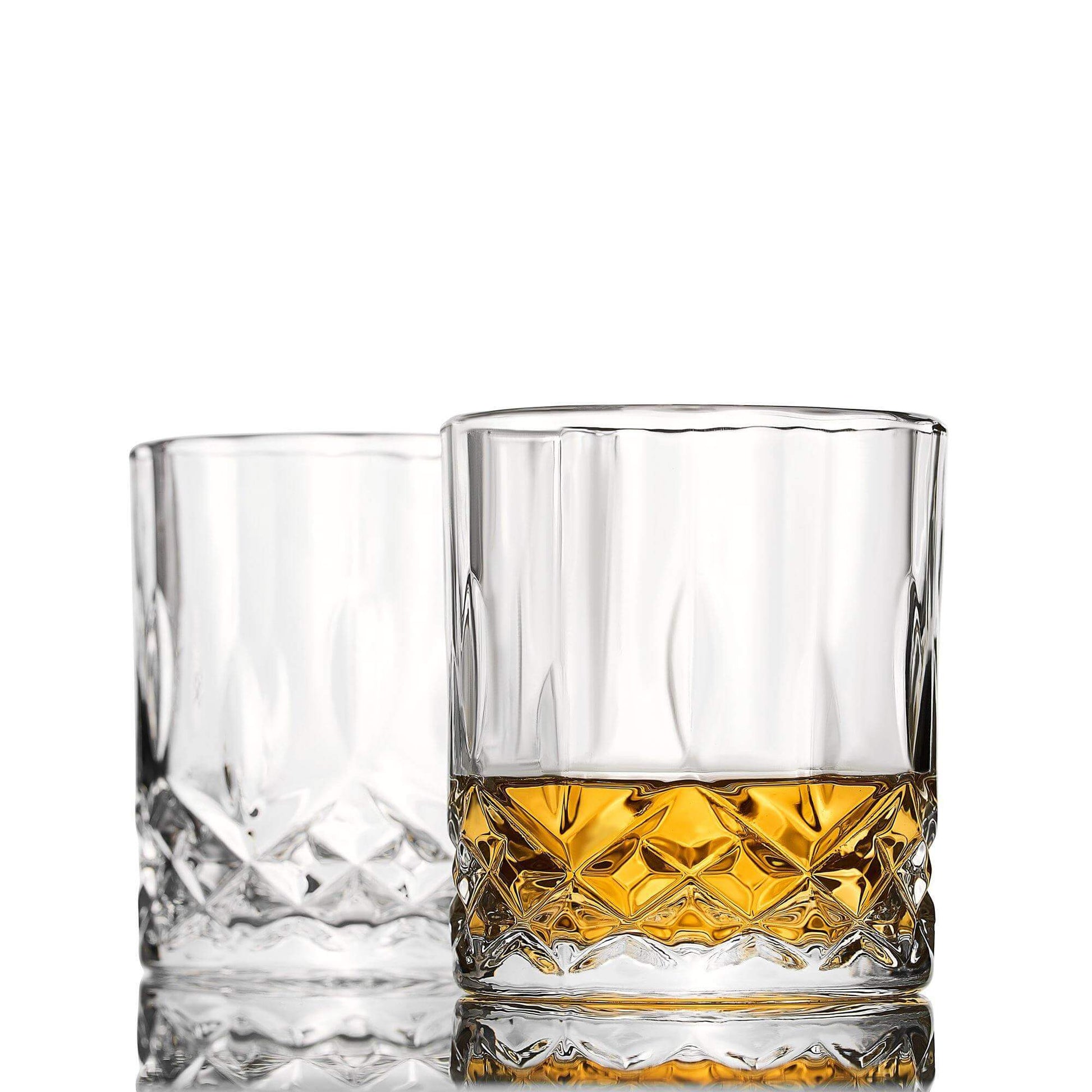 Whiskey connoisseur glass gift set signature edition — premium Father's Day gift for dad Two clear glass tumblers with one containing a yellow liquid on a white background