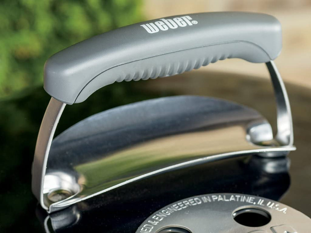 Weber Original Kettle grill set up in a backyard patio — gift for dad who has everything
