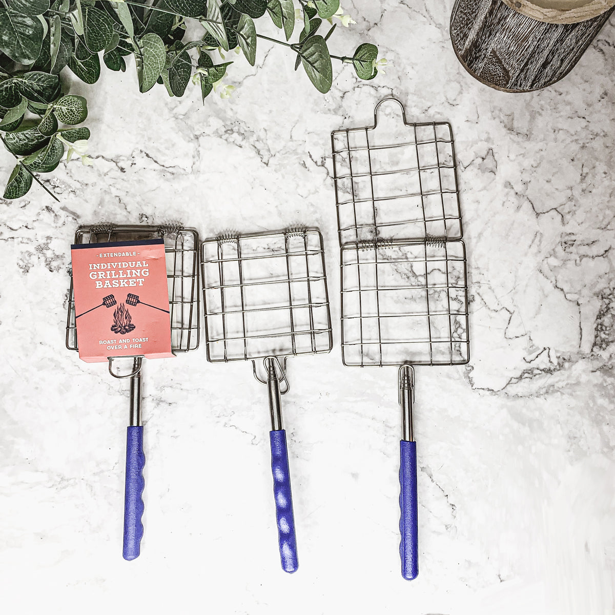 Cooking over a backyard fire pit with the extendable grilling basket — Father's Day gift for dad